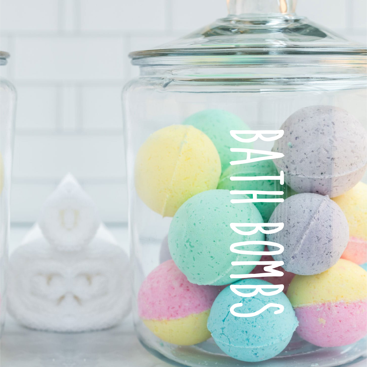 A large glass jar with a Bath Bombs decal stuck to the,